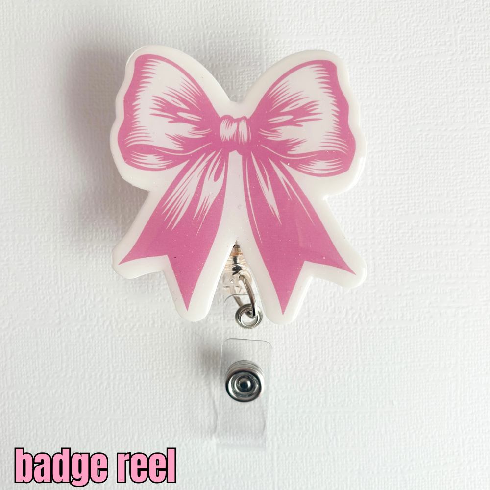 coquette, bow badge reel